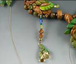 Clay and glass beads on beading wire